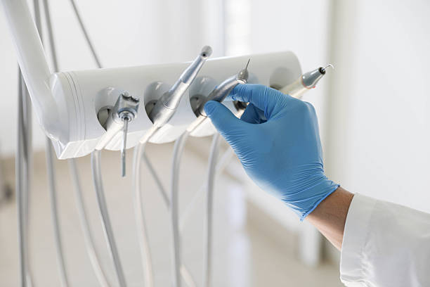 Professional Tooth Extraction technician working in Erie, KS